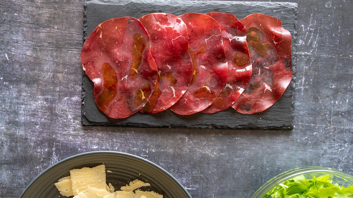 Beef Bresaola placed on a flat plate