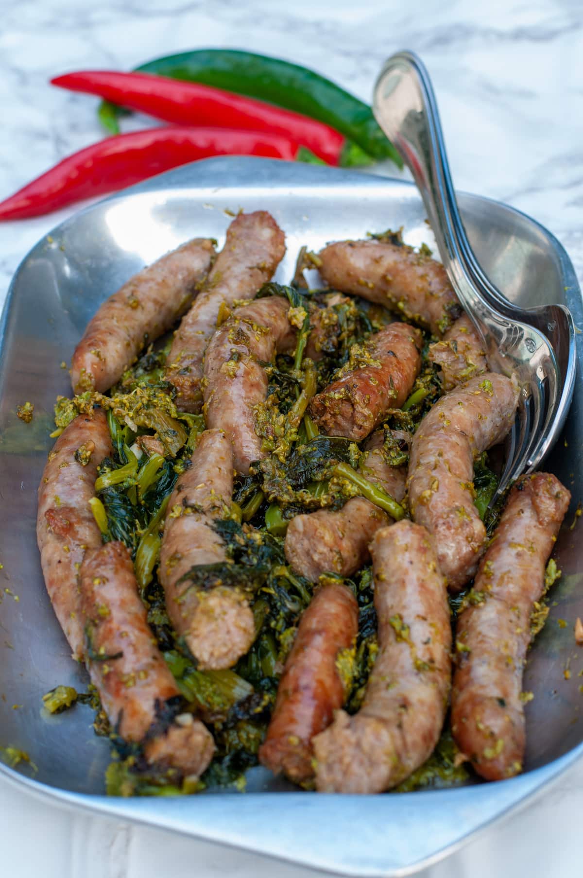 Serve sausage and Friarielli as a main dish