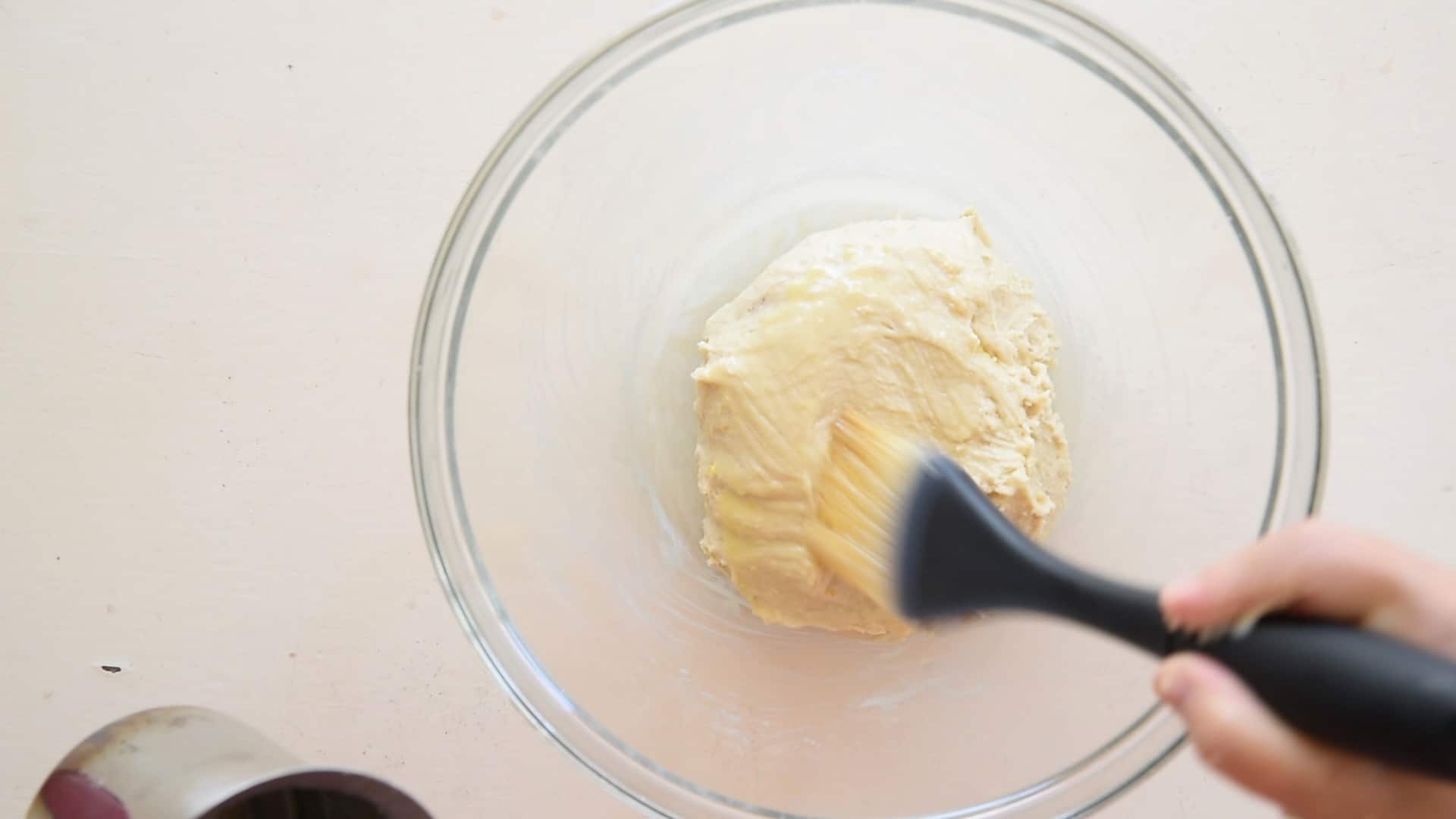 Place the dough into an oiled bowl
