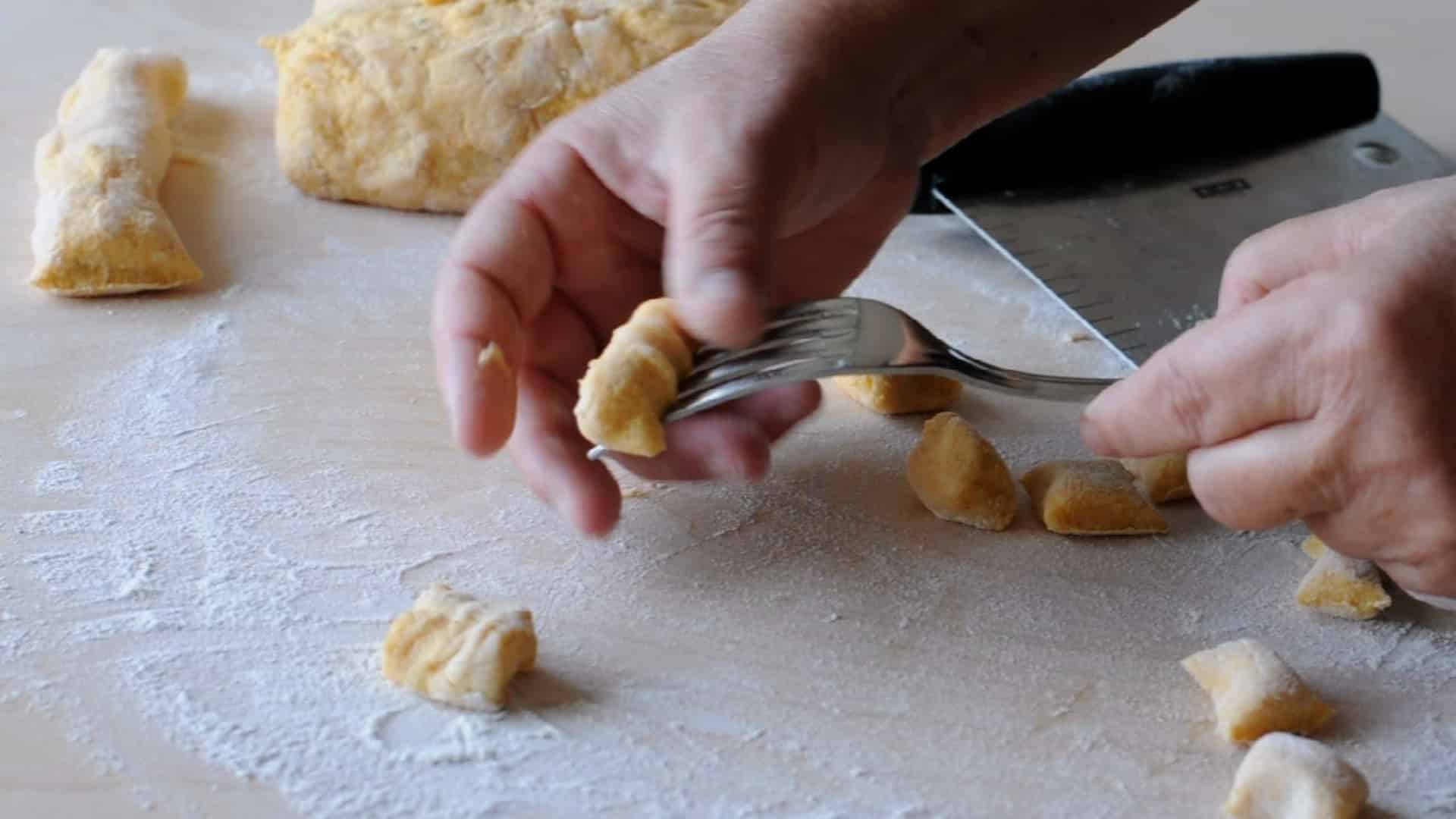 Gently press the back of a fork onto each gnocchi to create the classic ridged pattern