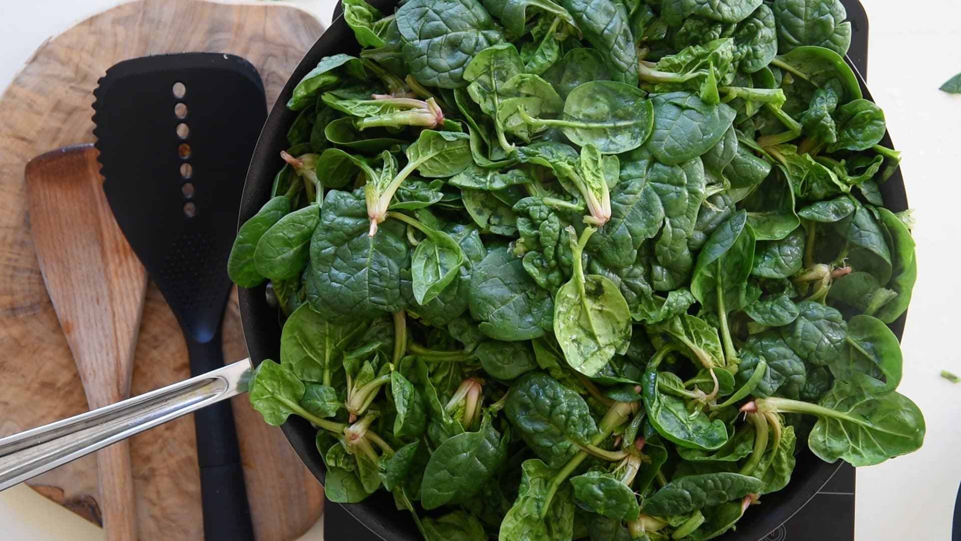 the spinach will fill over the pan