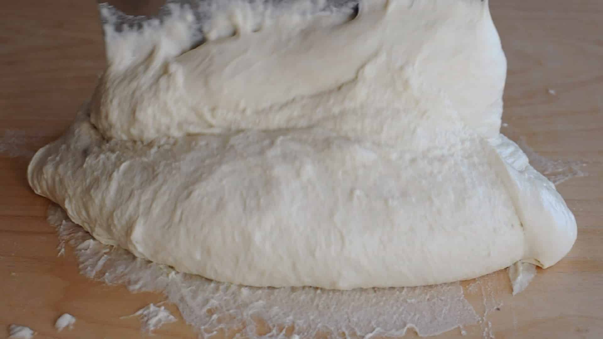 Lift the dough toward the center