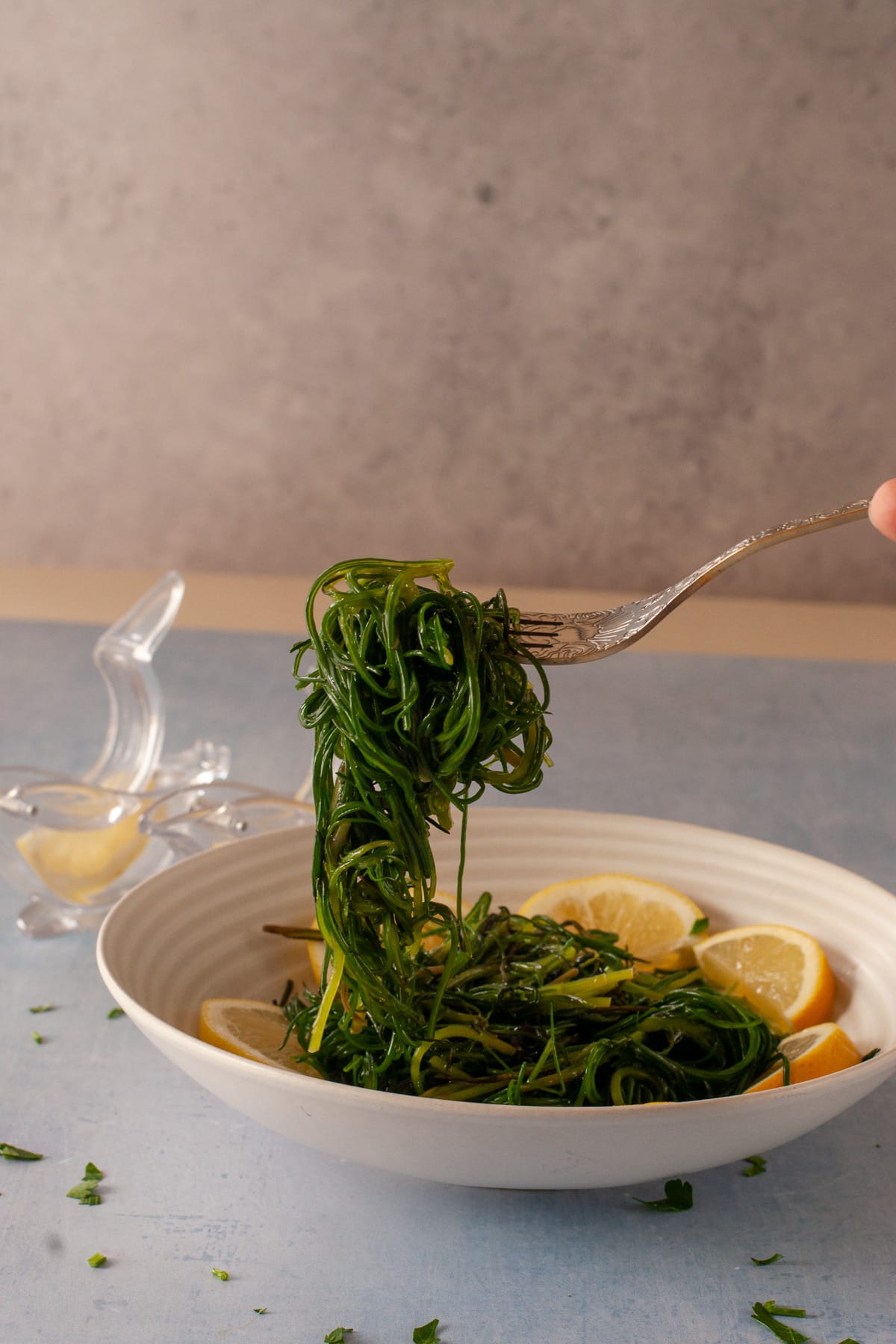 agretti lifted up with a fork