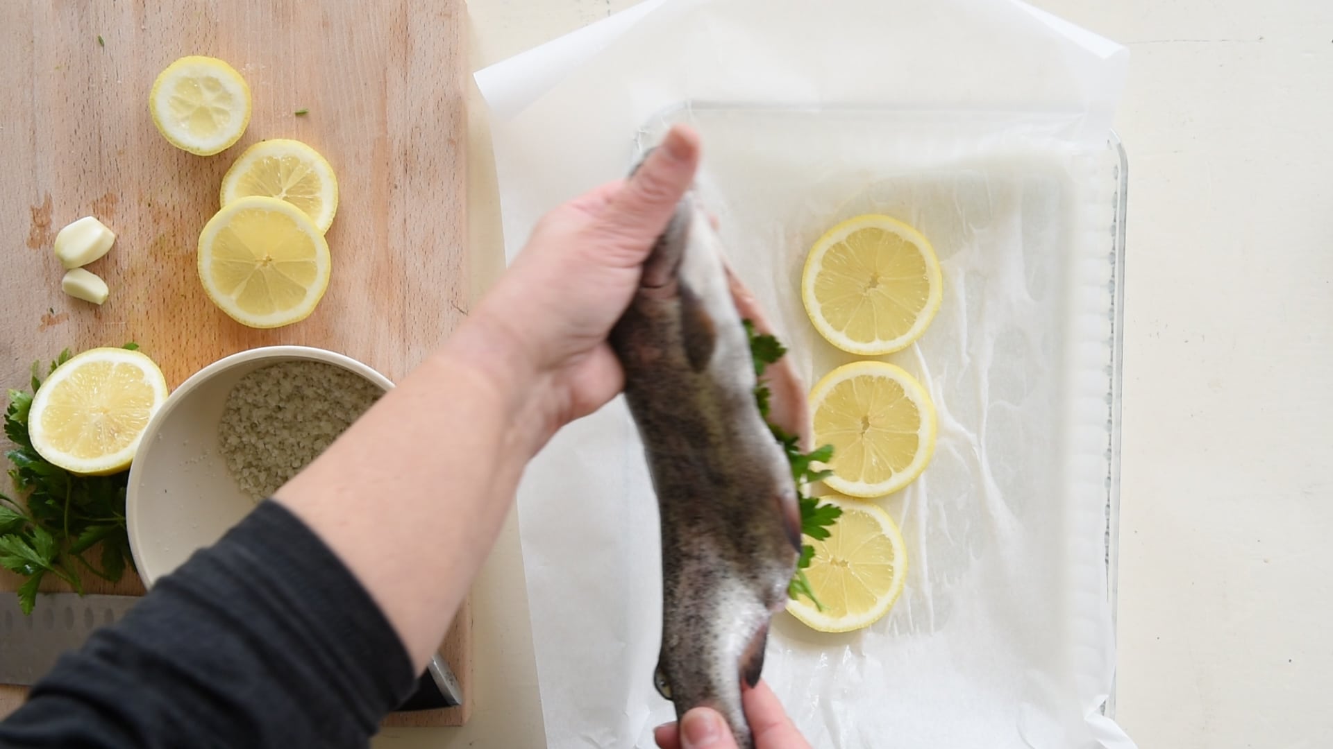 place the trout over the lemon