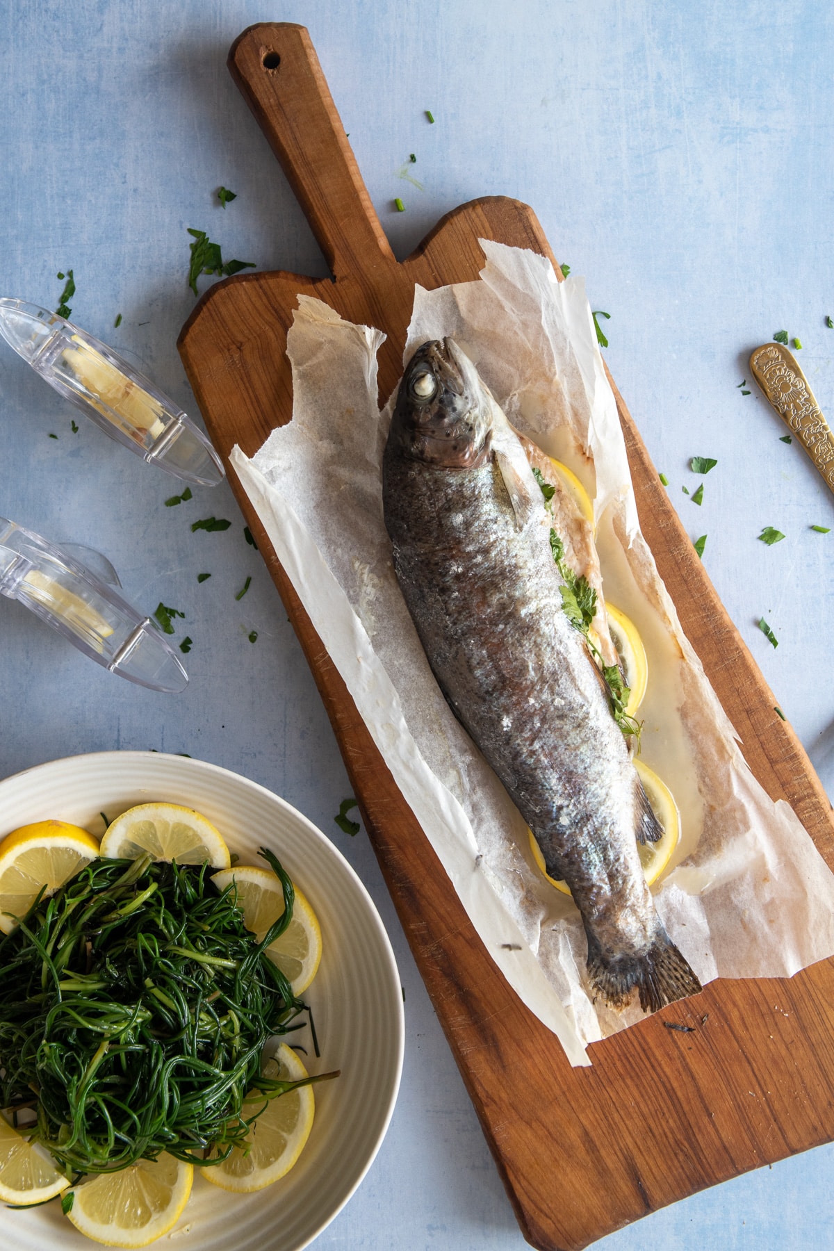 baked rainbow trout served with agretti