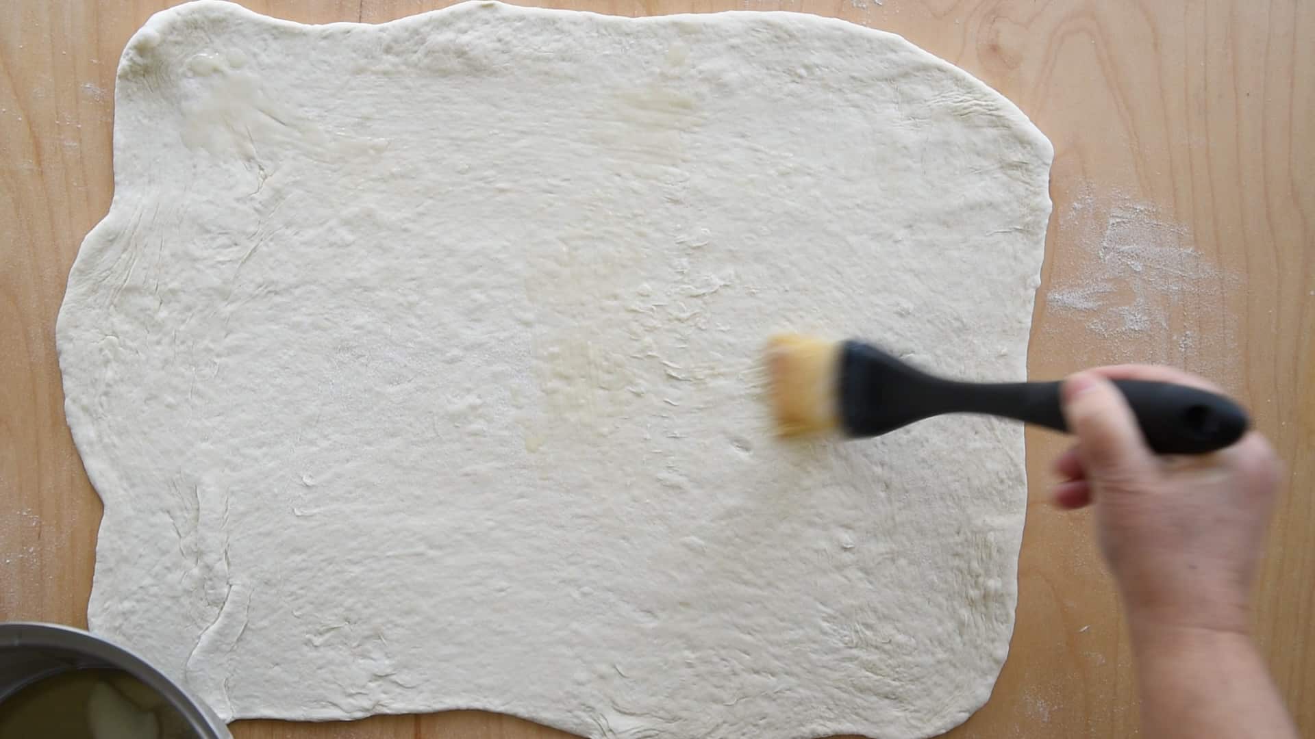 Brush the dough with lard