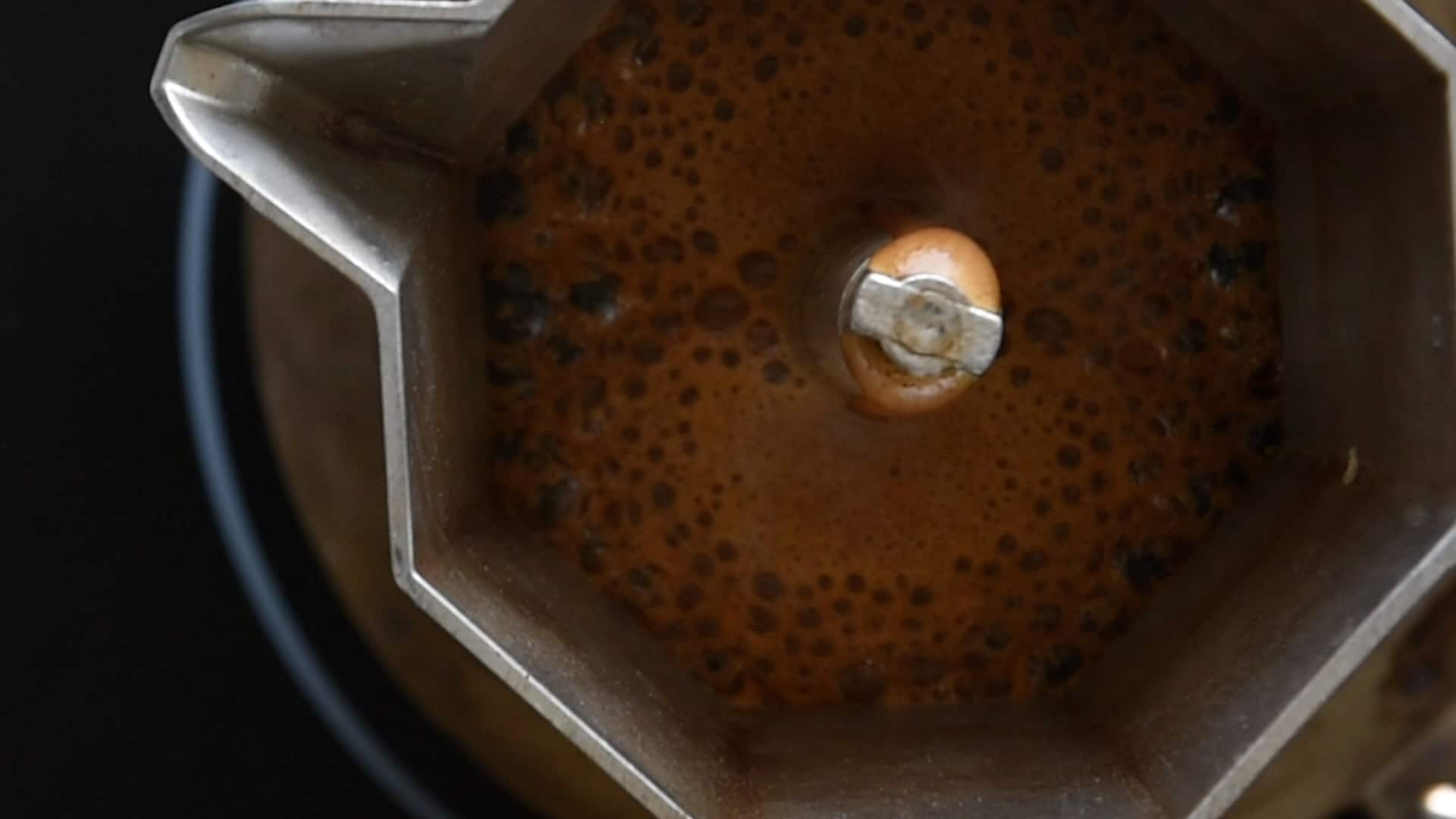 Coffee coming out in the top chamber