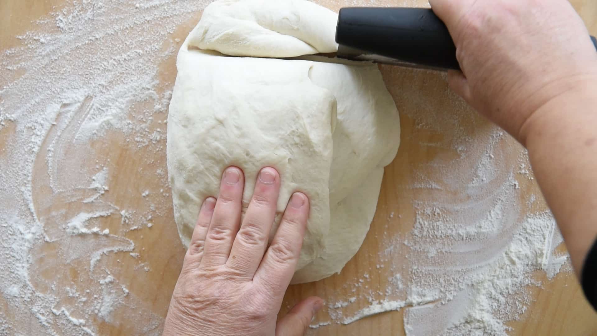 Remove a small piece of dough to decorate the Casatiello