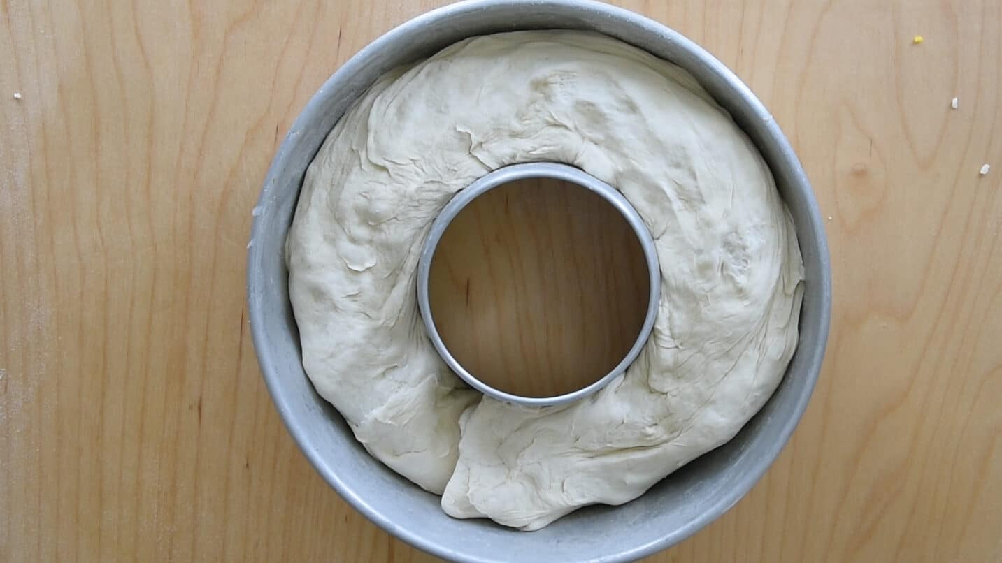Place the rolled dough into the pan