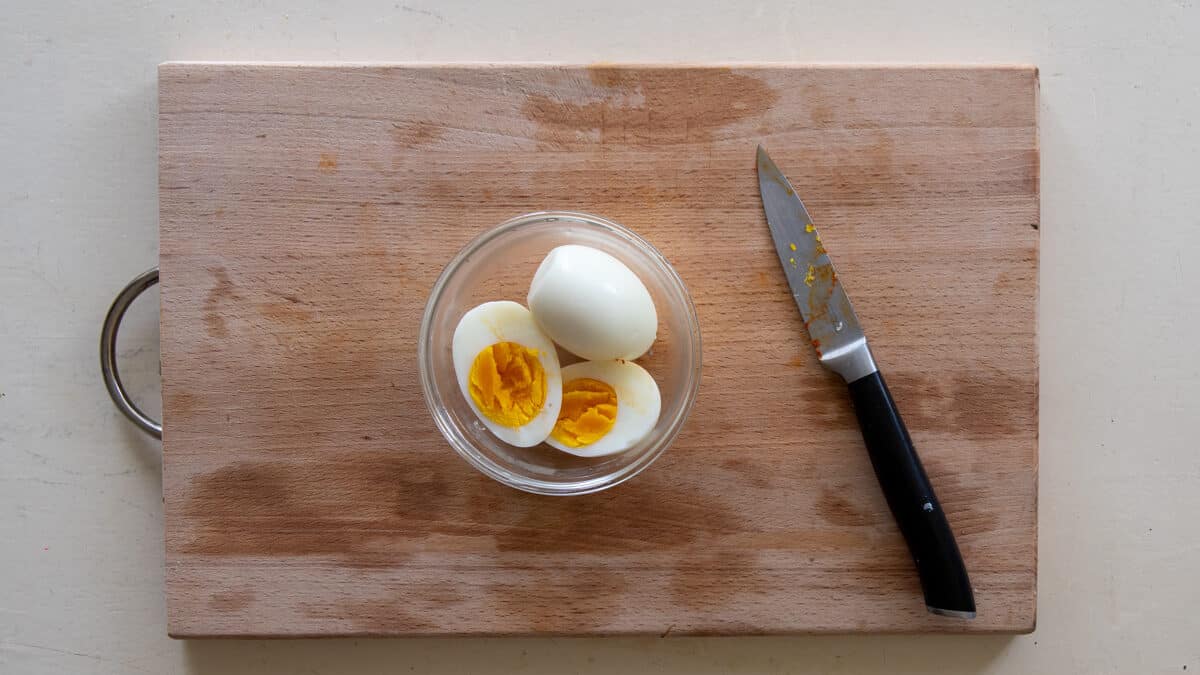 Chop the boiled eggs for the Tortano
