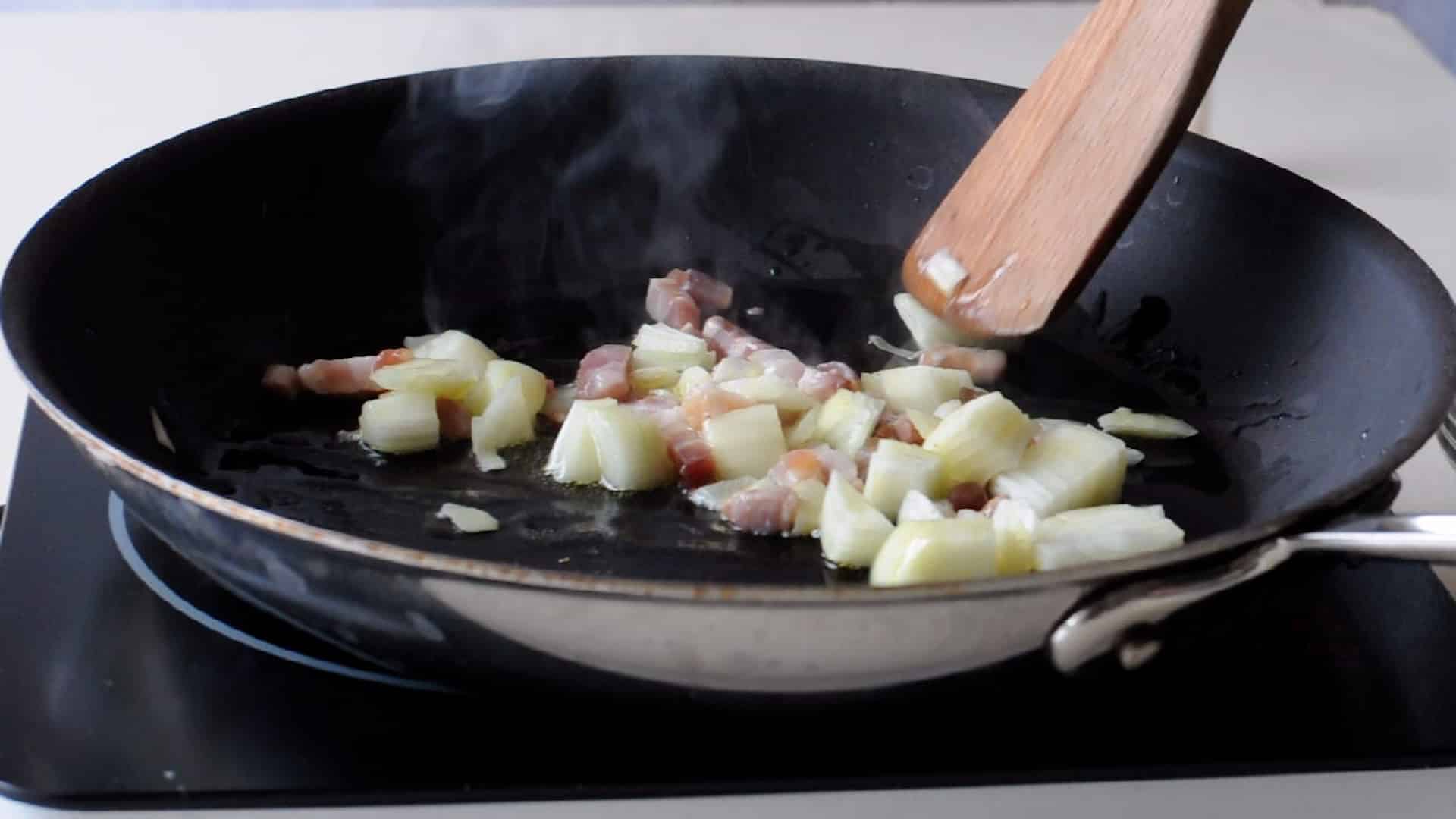 stir fry the onion and the bacon