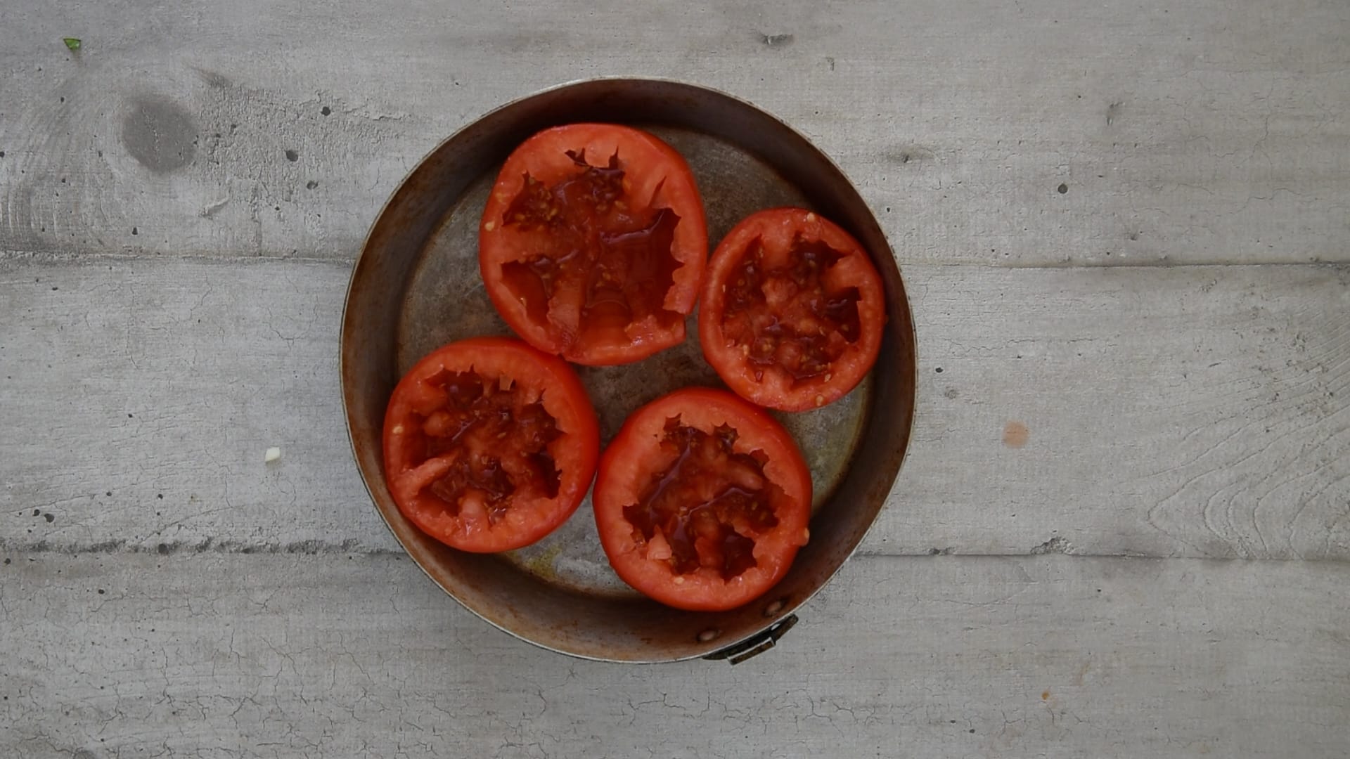 fitting the tomatoes in the pan