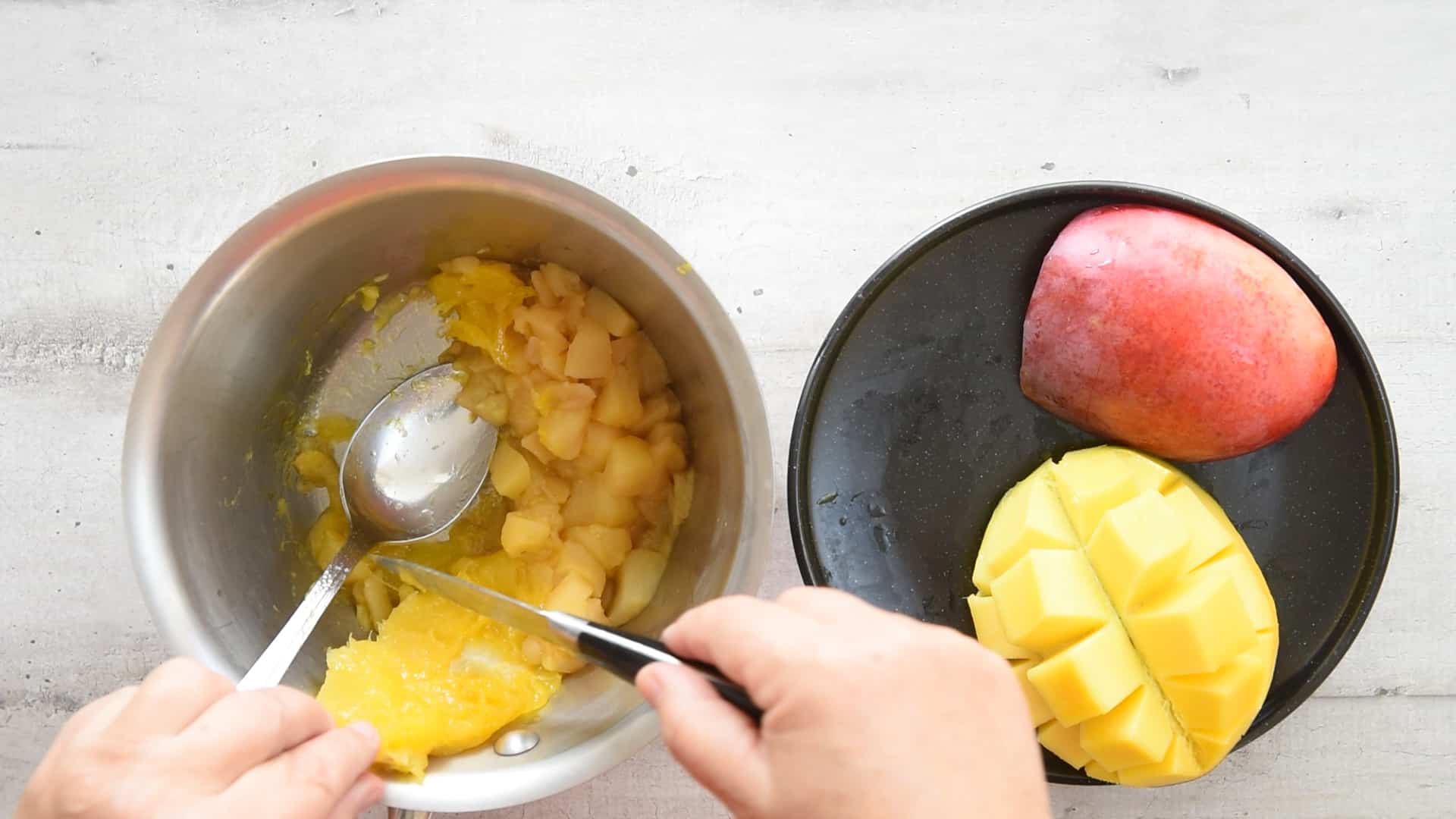 squeeze the mango juices from the bone