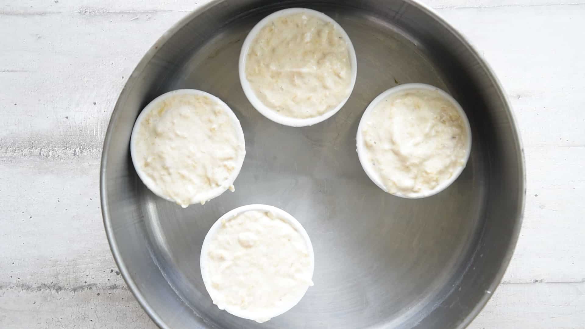 Place the ramikins into the large pan