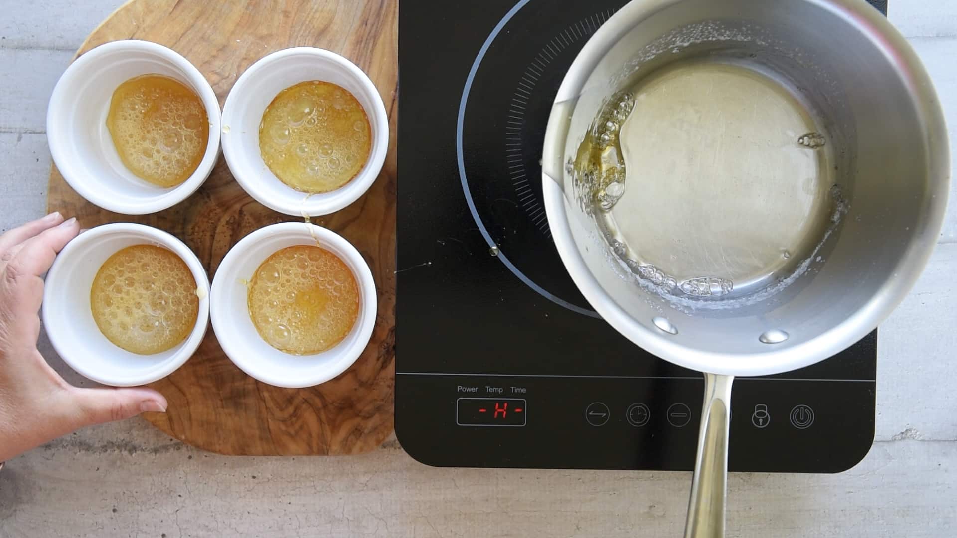 Pour the caramel into the ramekins