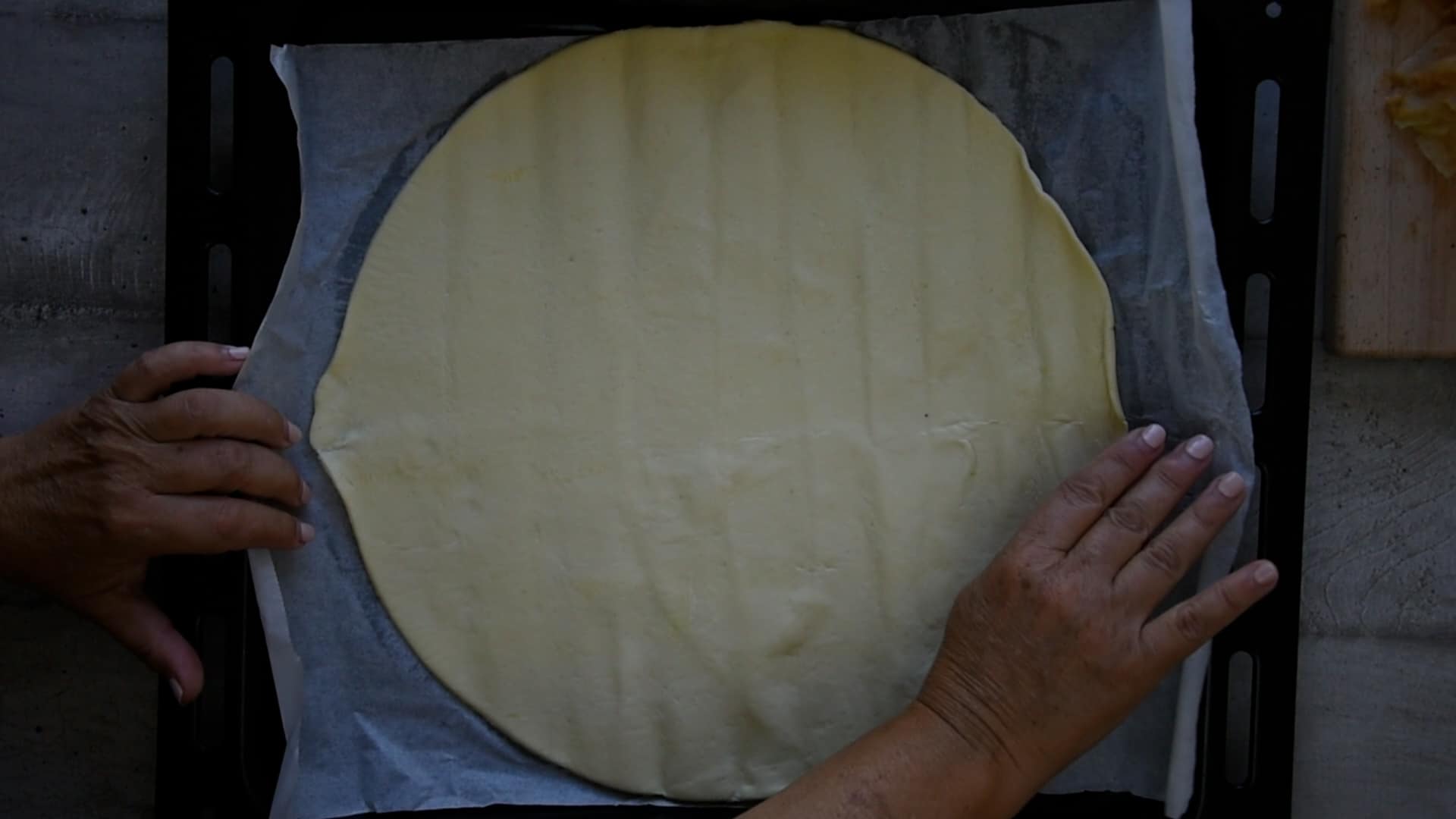 open the dough sheet on the baking pan