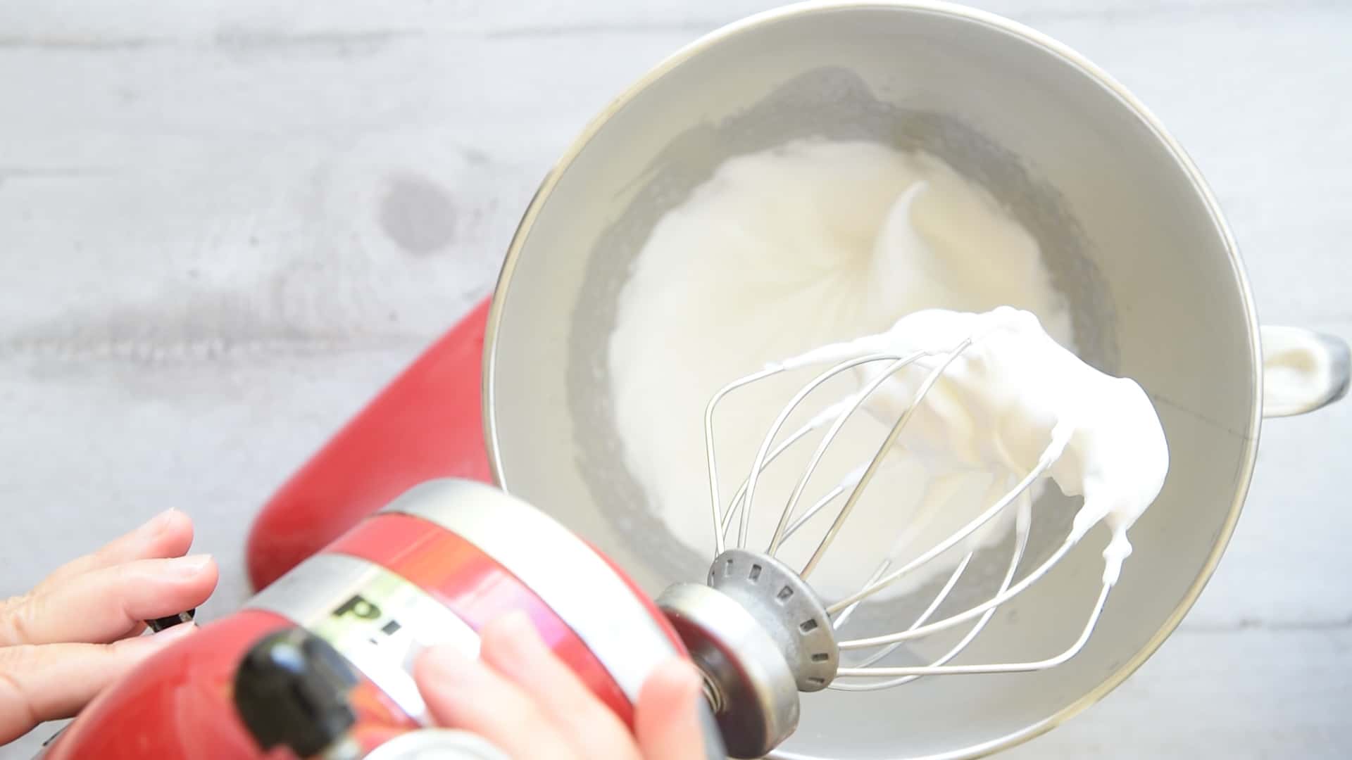 Whisk the egg whites and the sugar until stiff