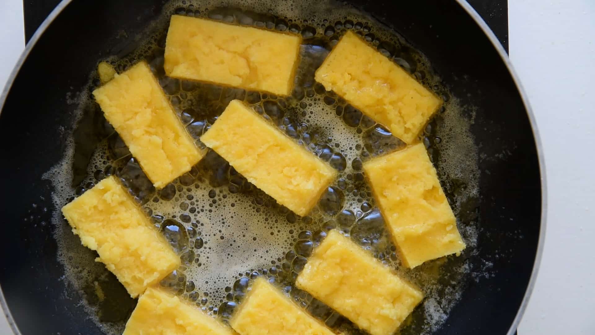 Place the polenta in the pan
