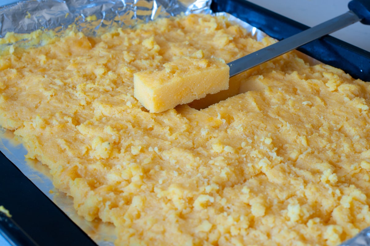 Cut into cubes once the polenta is firm