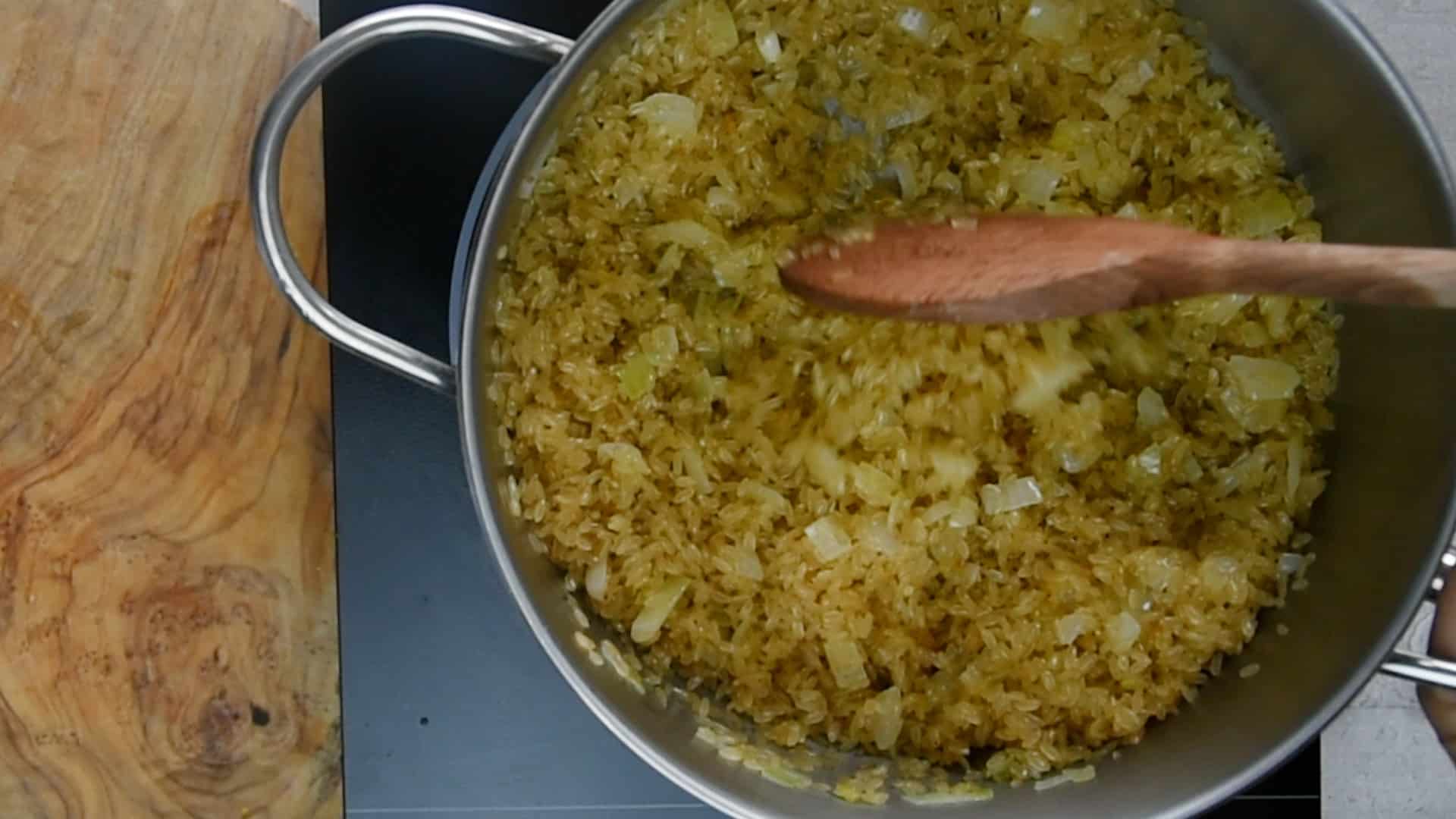 lower the heat to medium-low and stir until the grains are dry and evenly heated