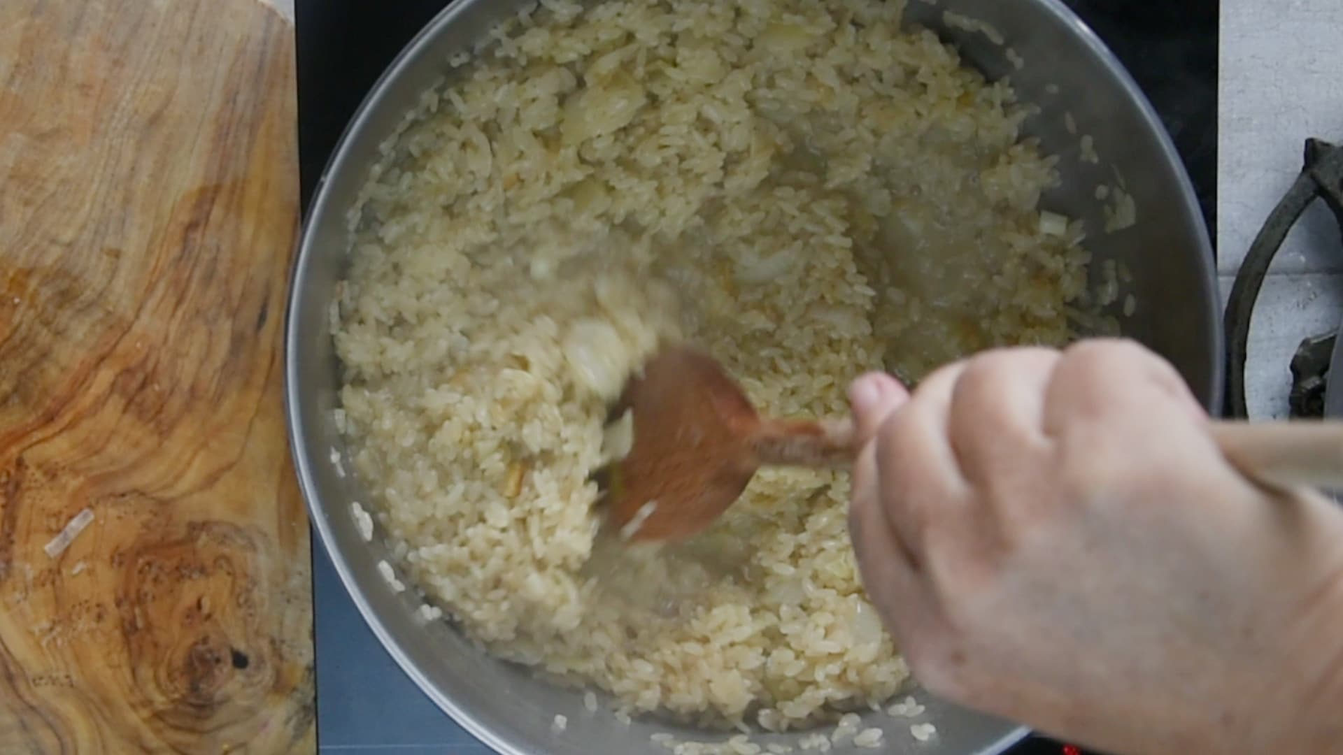 Wait until the liquid is almost completely absorbed before adding the next ladleful.