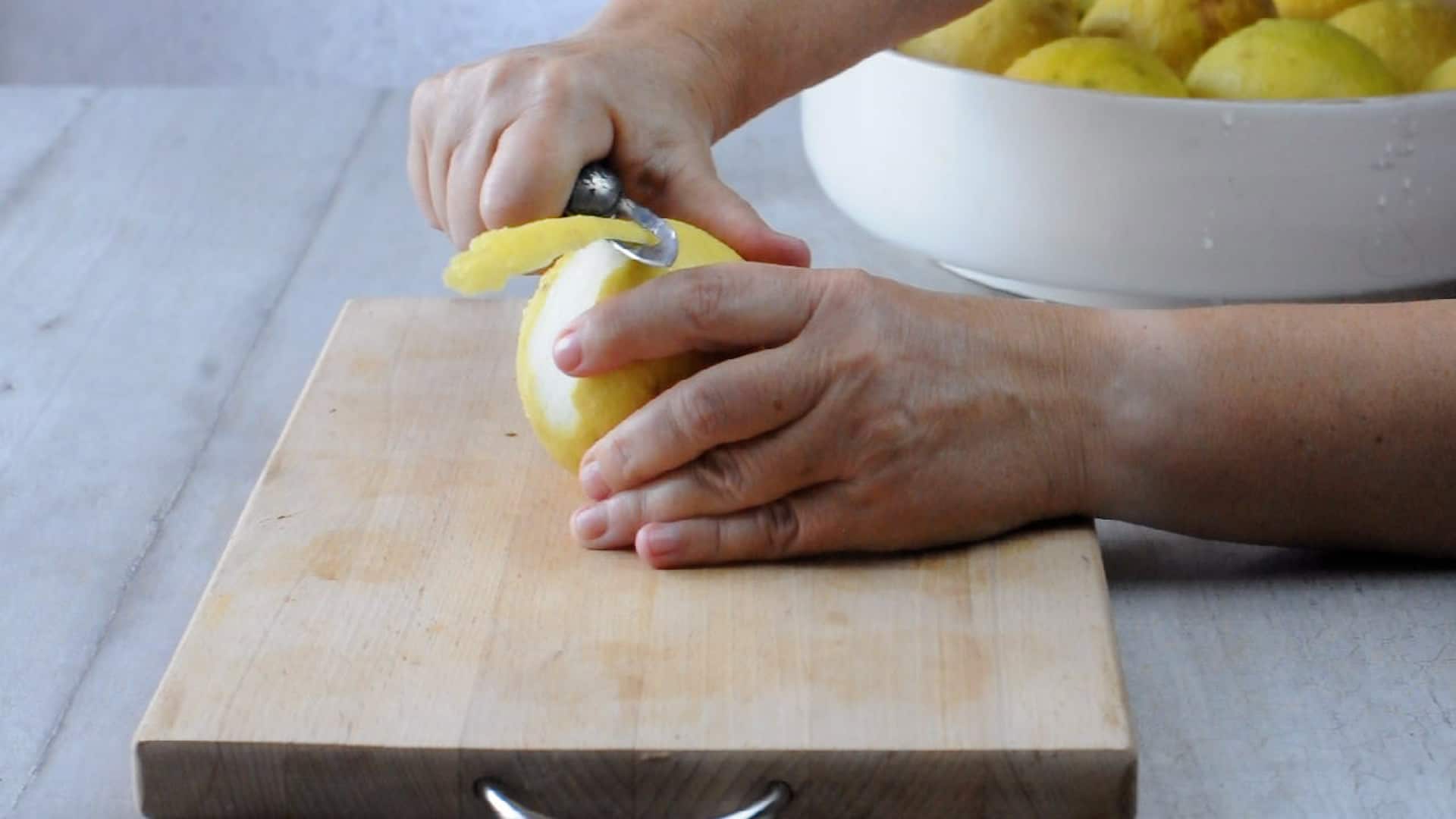 Use a peeler to peel the lemons