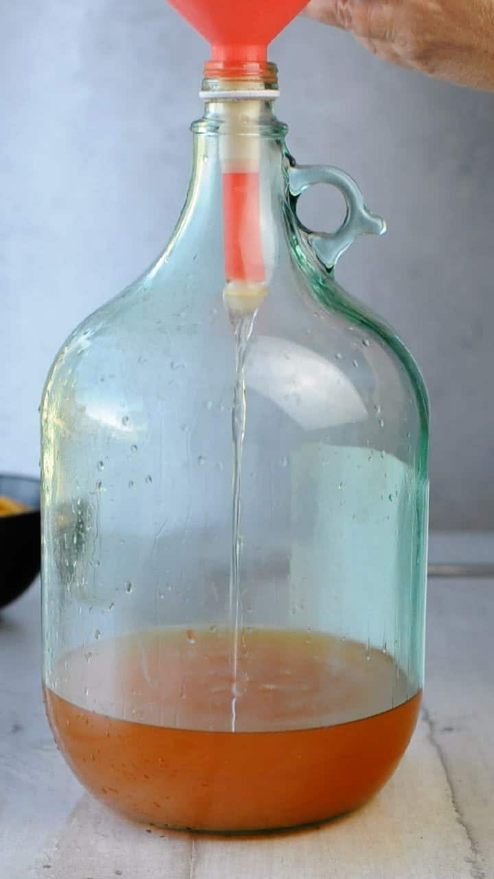 Place the filtered alcohol back into the bottle