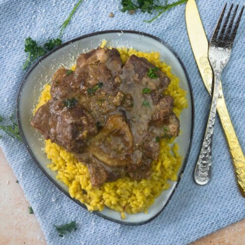 Ossobuco alla Milanese served over the risotto alla milanese