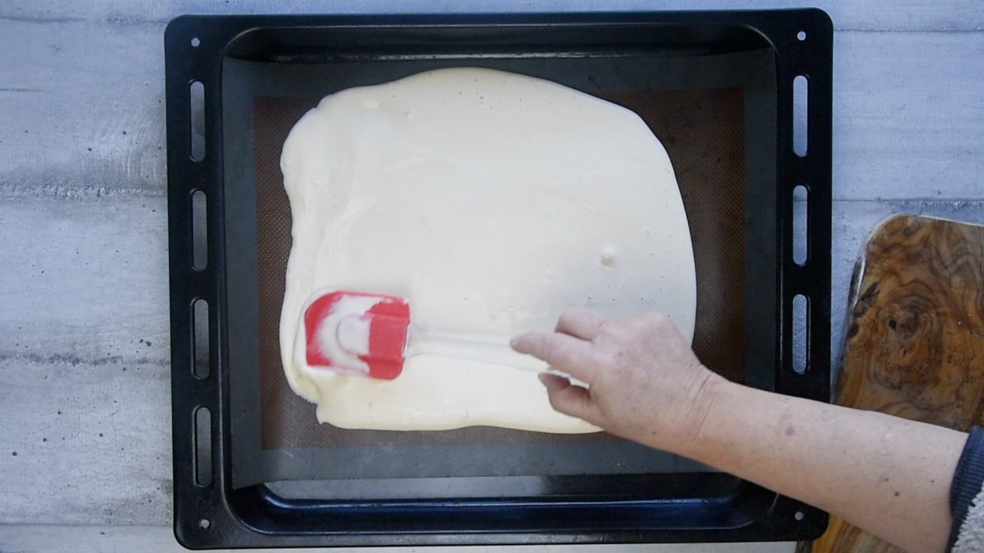 Spread the mixture evenly onto a baking tray