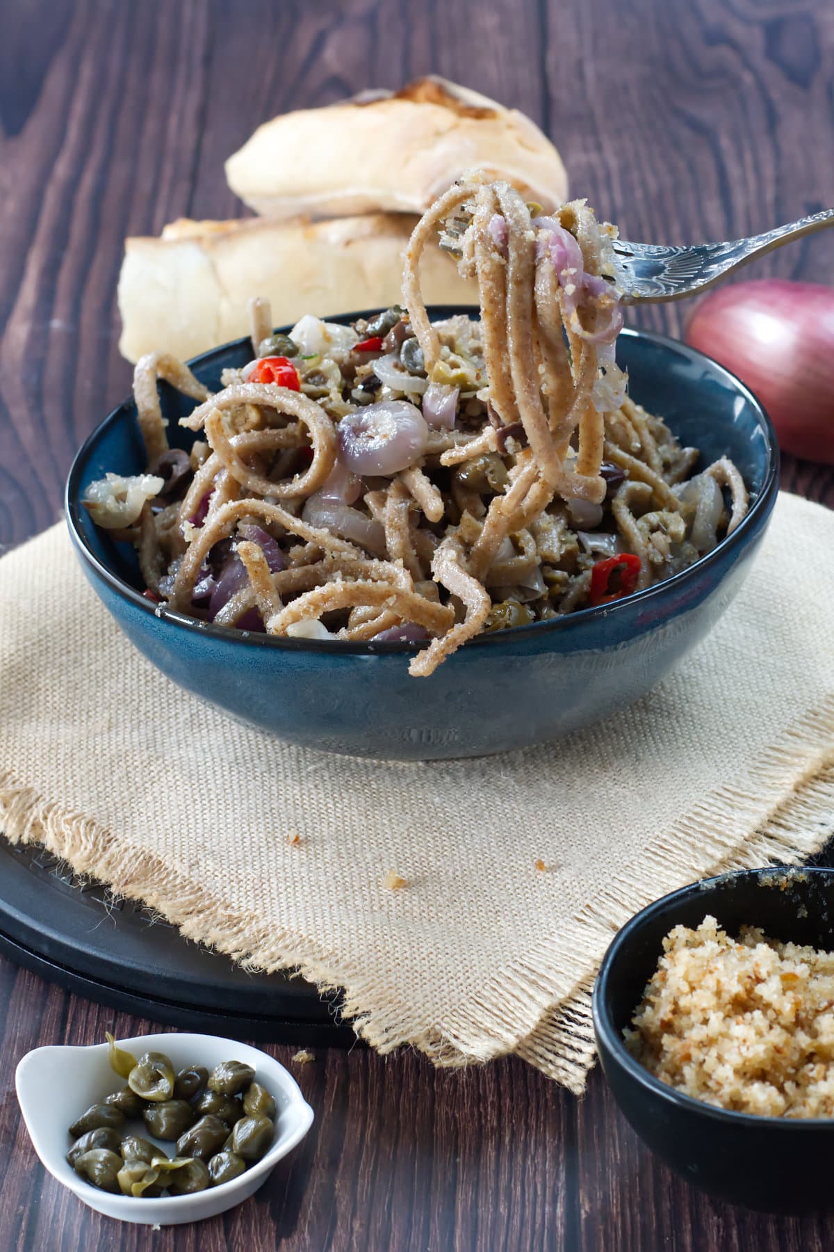 stroncatura calabrese served with onion, olives and anchiovis