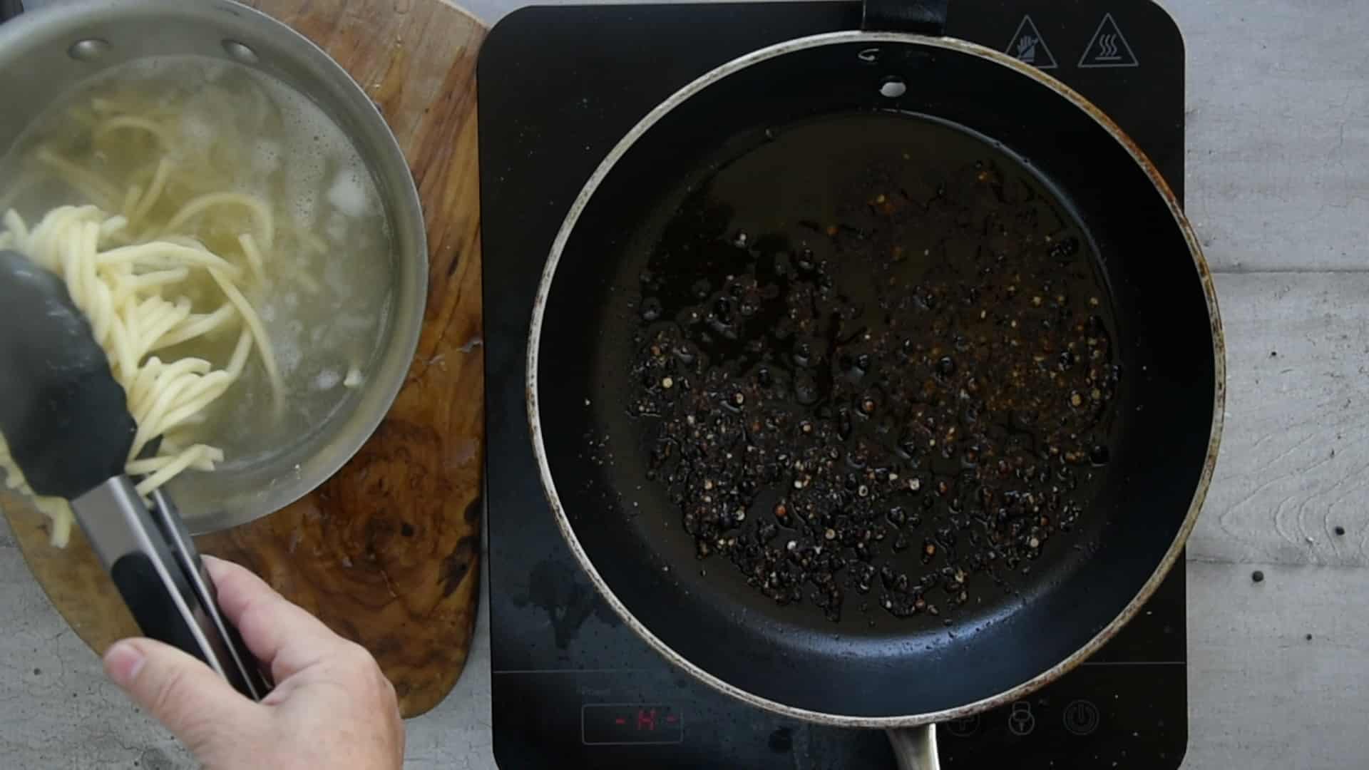 Drain the pasta with a fork