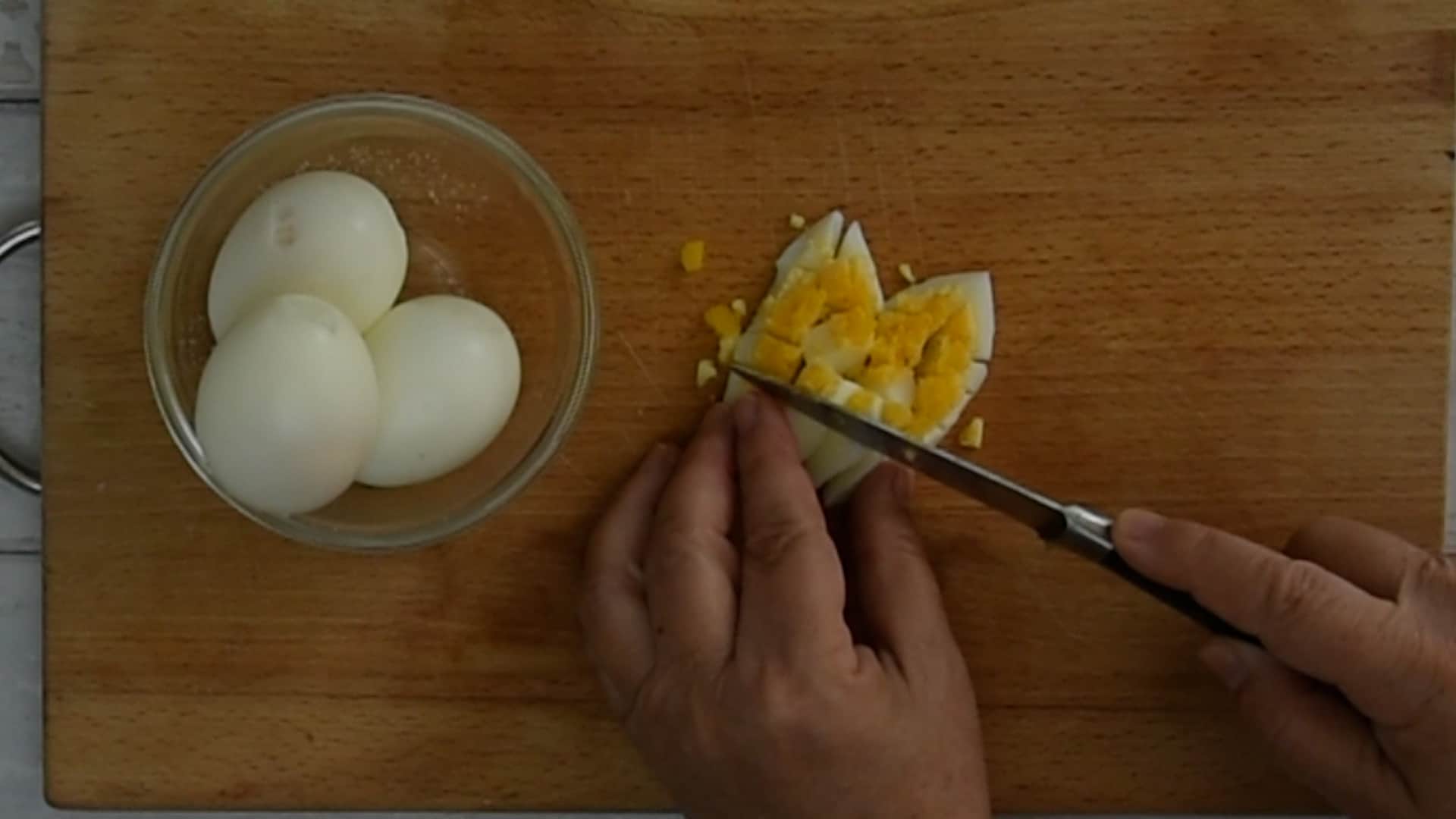Chop the boiled eggs
