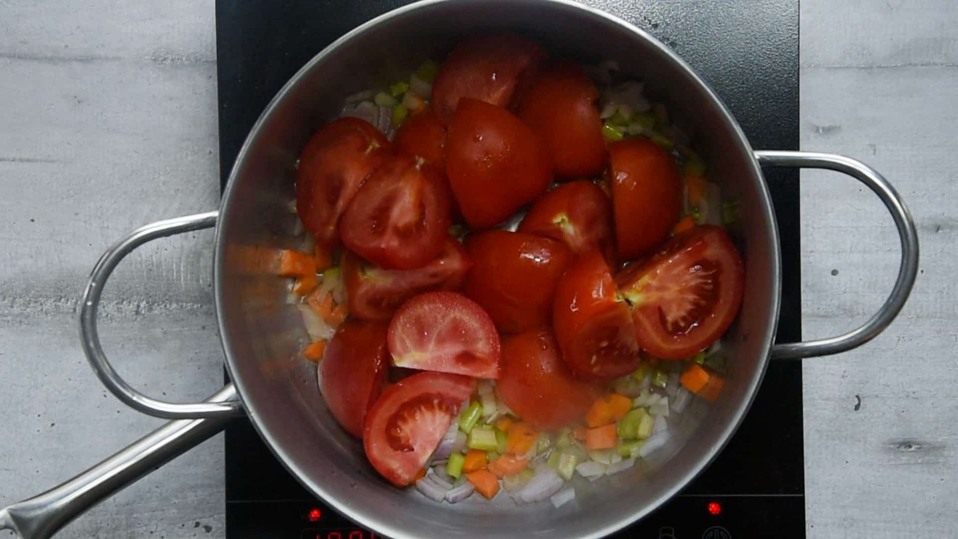 Add the sliced tomatoes