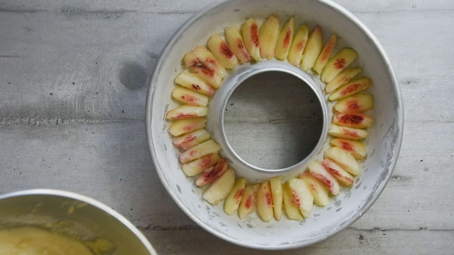 Lay the peaches at the bottom