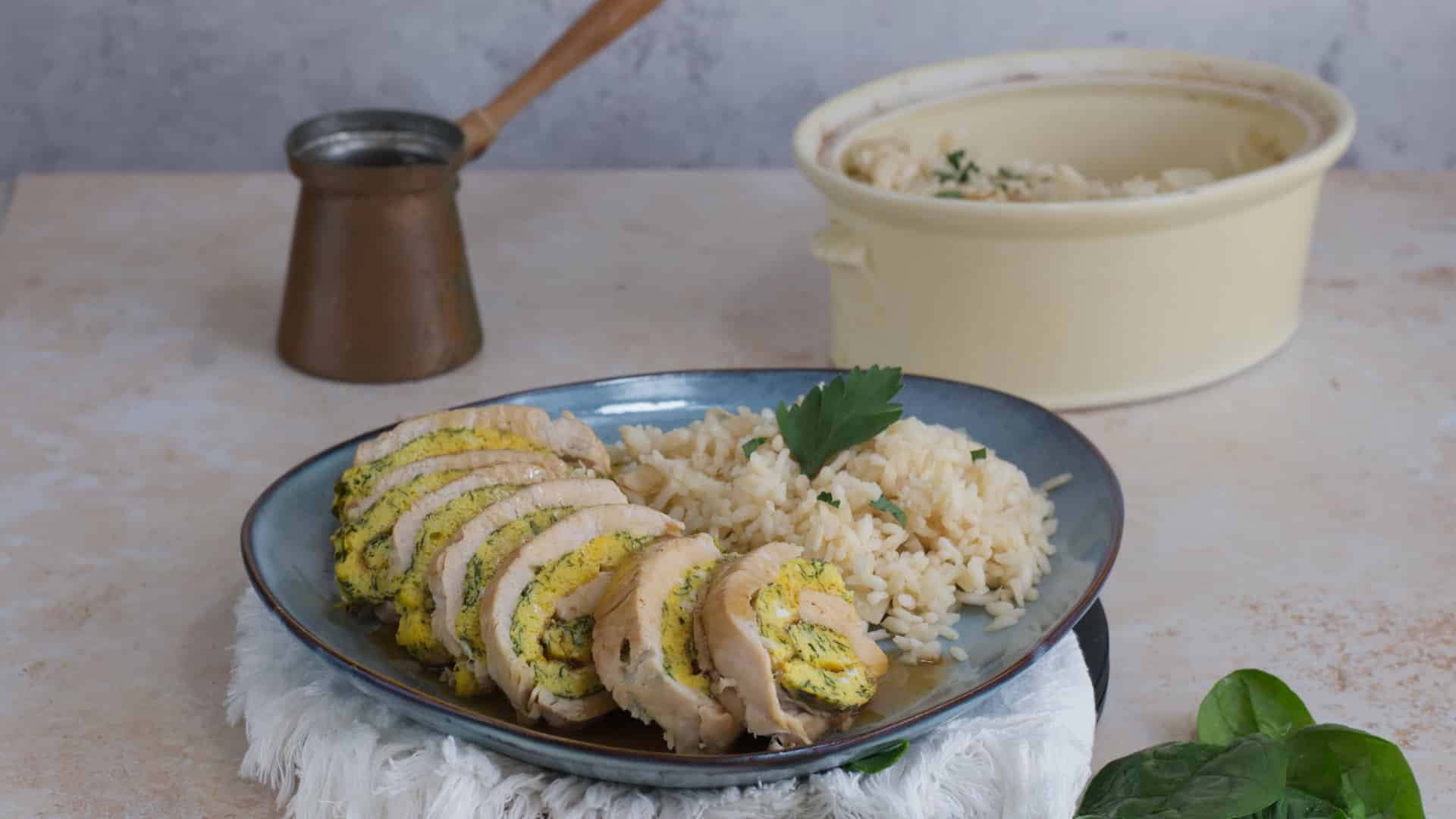 Turkey roll served with pilaf rice