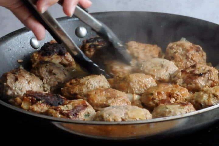 Turn the meatballs during cooking