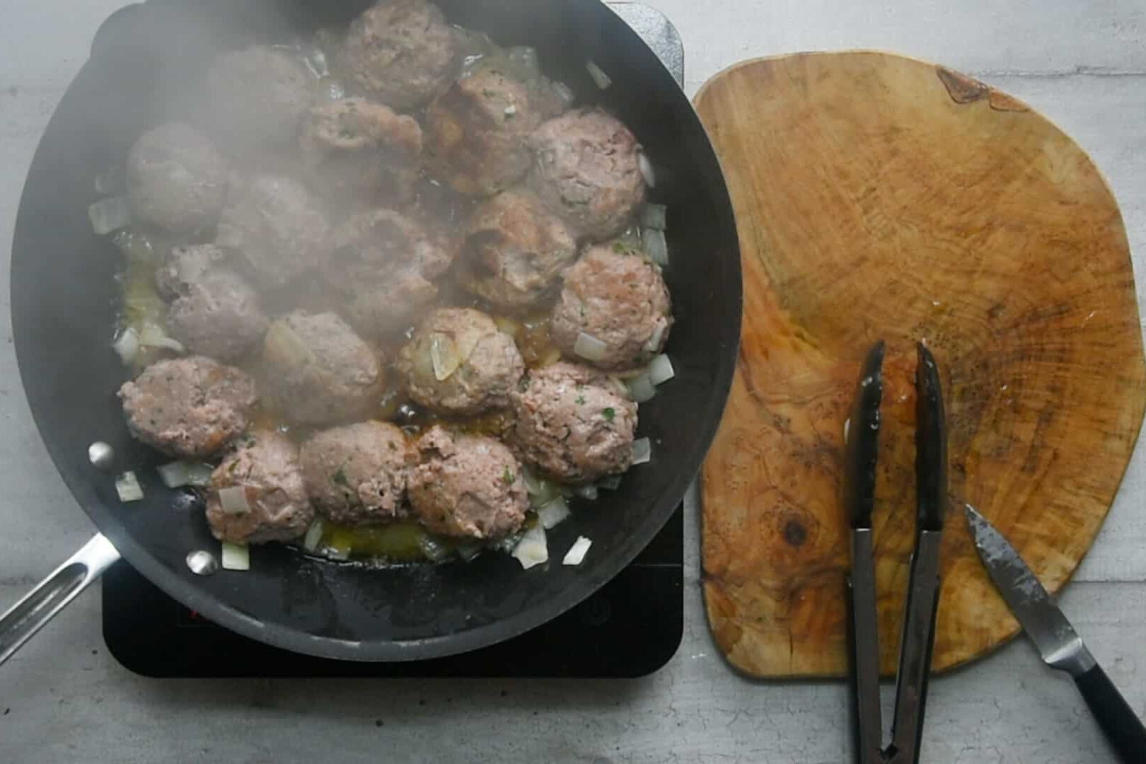 Sear the meatballs until browned on all sides.