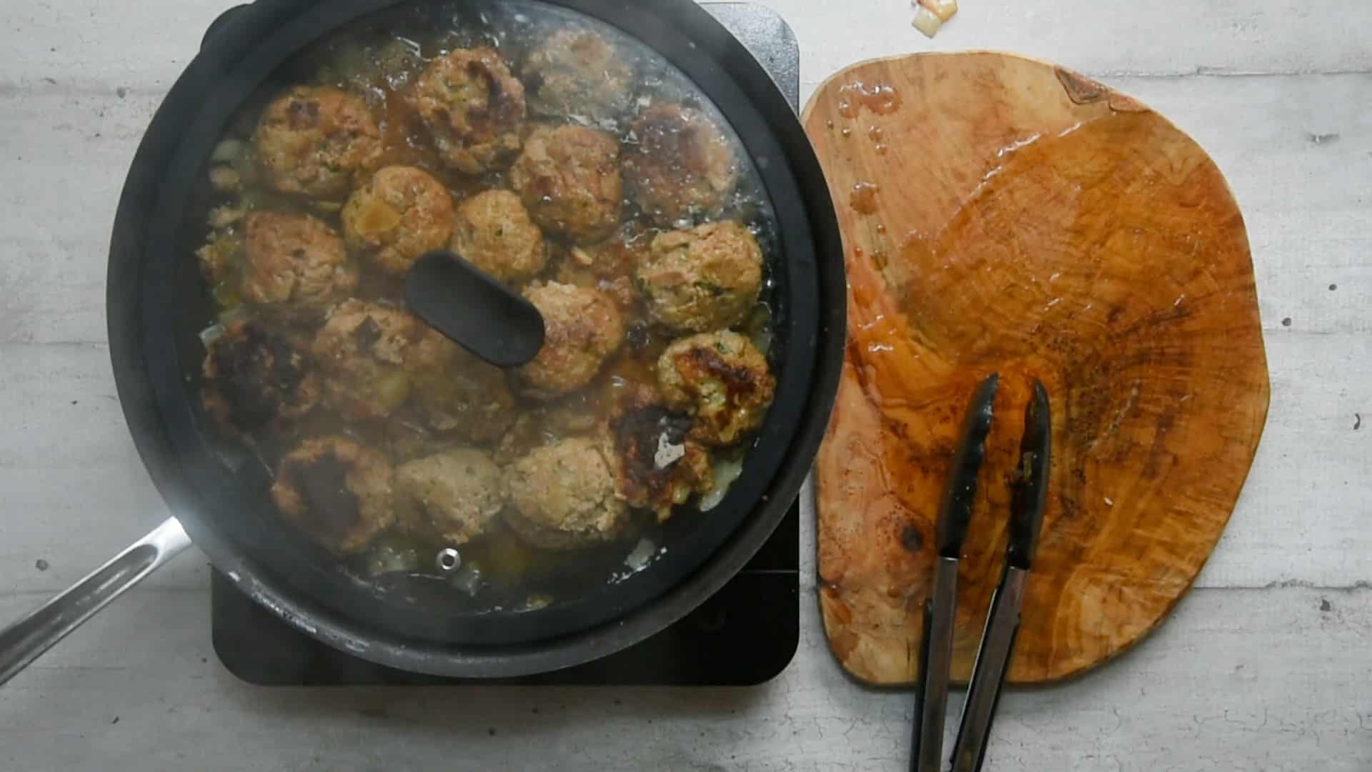 meatballs cooking with the lid